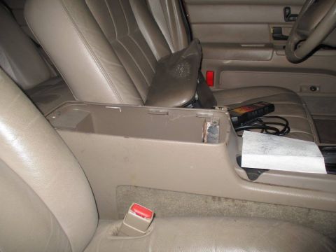 2004 Ford Crown Victoria - Interior view of a vehicle's center console and front seats.
