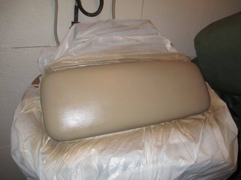 2004 Ford Crown Victoria - Car armrest, likely for a Ford Crown Victoria, is covered in plastic wrap.