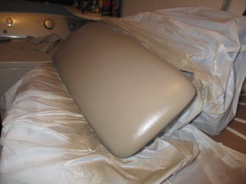 2004 Ford Crown Victoria - A car's armrest is covered in plastic and placed on top of a washing machine.