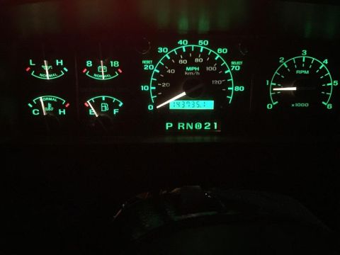 1996 Ford Bronco - The illuminated dashboard gauges display the vehicle's operational status and mileage.