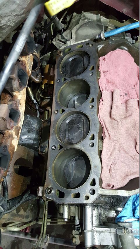 1996 Ford Bronco - Close-up view of an engine block, showing the cylinders and pistons during a repair or rebuild.