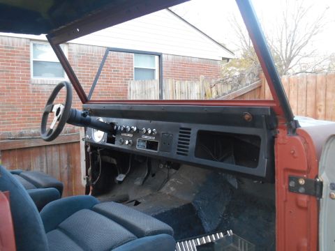 1972 Ford Bronco - The interior of a 1972 Ford Bronco shows blue seats and the dashboard, indicating a restoration project.