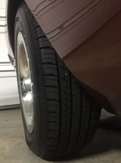 1971 Dodge Dart - A car's tire and fender are visible in this close-up shot.