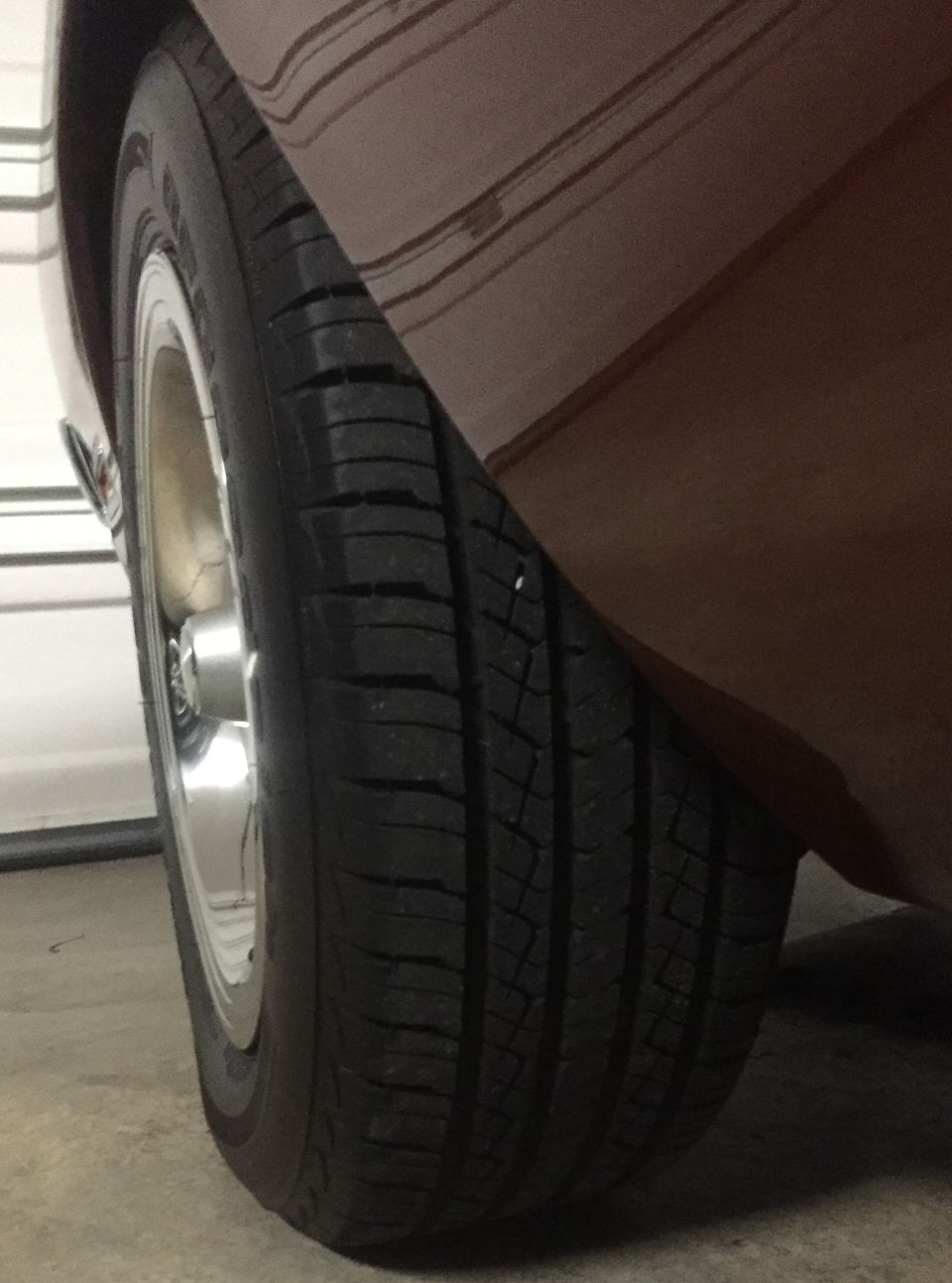 Close-up of a car tire and part of the fender