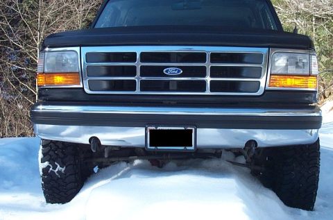 1995 Ford Bronco - Front view of a black 1995 Ford Bronco parked in a snowy landscape.