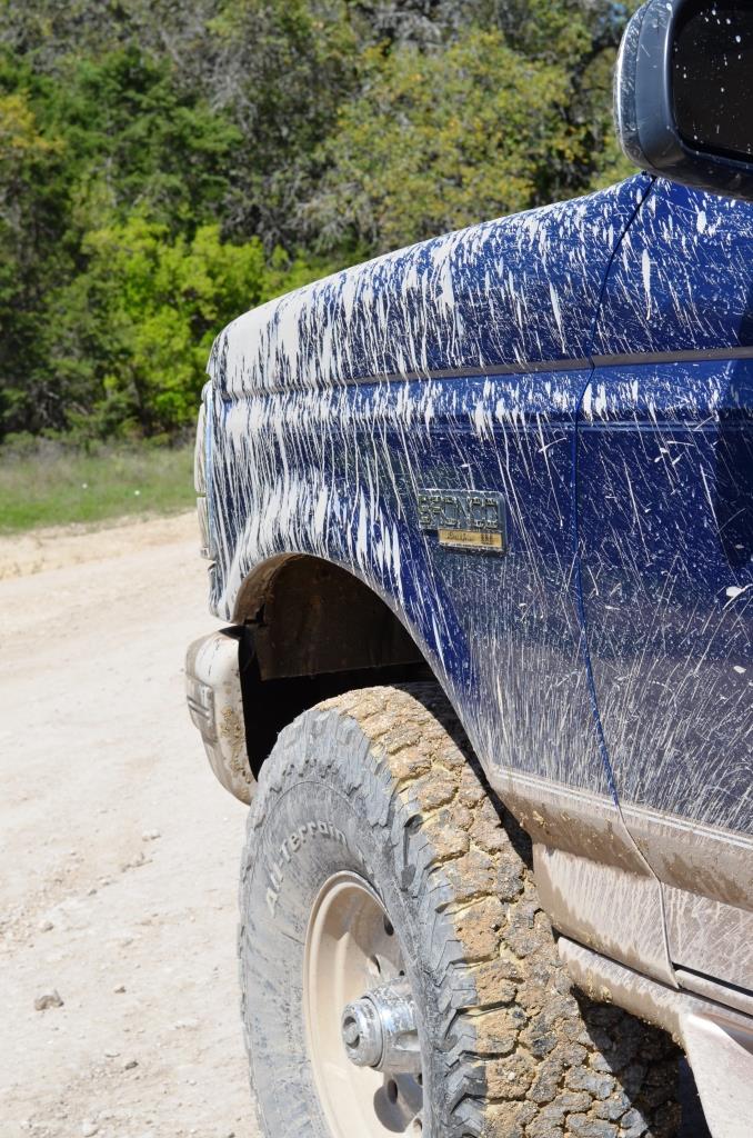 Muddy blue truck, looks like a Ford F-Series from the 90s