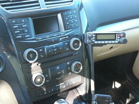 2016 Ford Explorer - Dashboard of a 2016 Ford Explorer with a radio unit attached to the passenger side.