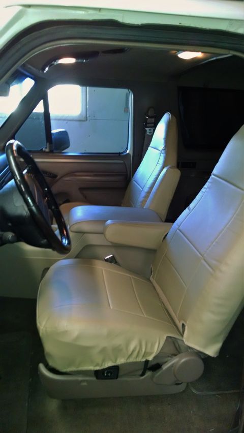 1994 Ford Bronco - Interior view of a 1994 Ford Bronco, highlighting the front seating area and controls.