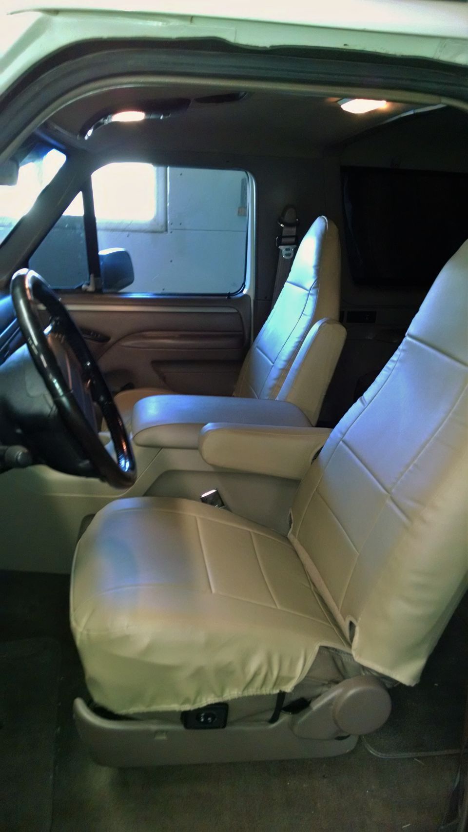 1994 Ford Bronco interior showing front seats, steering wheel, and dashboard
