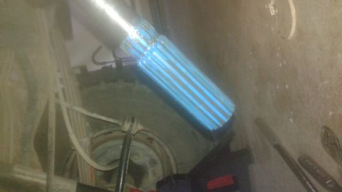 1996 Ford Bronco - Close-up of a driveshaft with blue coating and visible splines, likely a vehicle part.