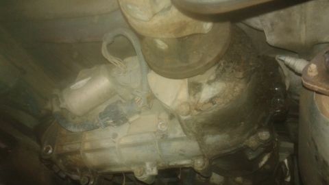 1996 Ford Bronco - This photo shows the underside of a vehicle, focusing on the transmission and exhaust components.
