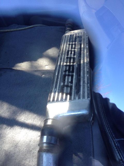 1995 Ford Probe - A close-up view of an intercooler component with visible text, likely a car part.