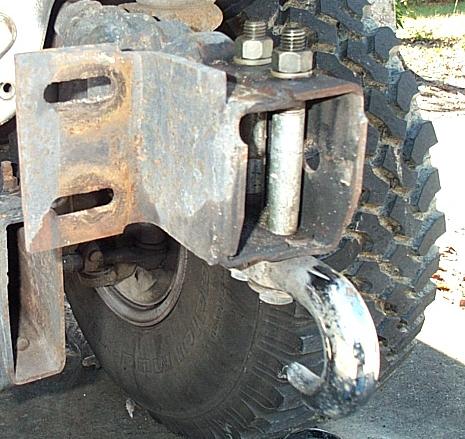 1995 Ford Bronco - Detail of a tow hitch receiver and tire, likely from an off-road vehicle.