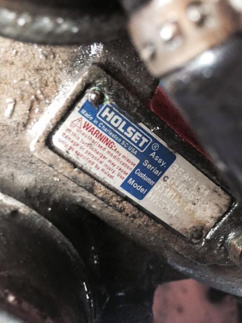 1995 Ford Probe - A close-up view of a Holset turbocharger identification plate with visible text including "Made in Charleston SC USA" and "WARNING". The pl…