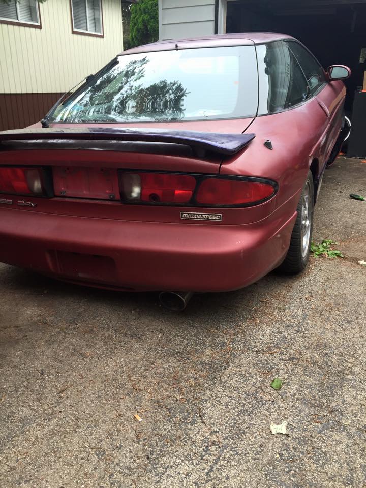 Red 1995 Ford Probe GT rear driver's side quarter view
