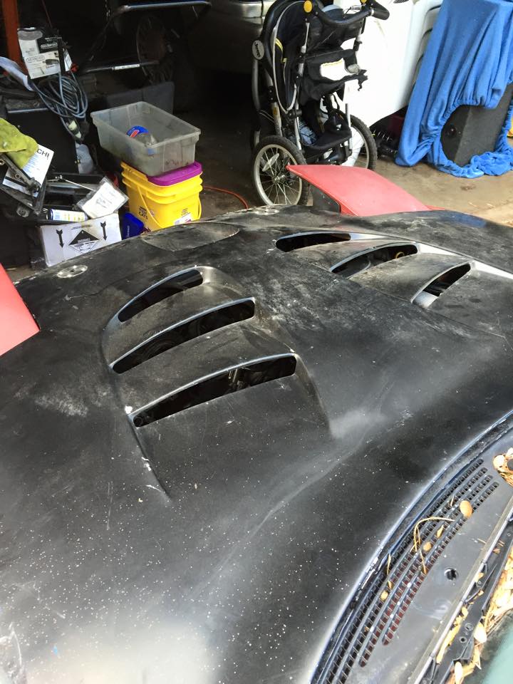 Black car hood with vents