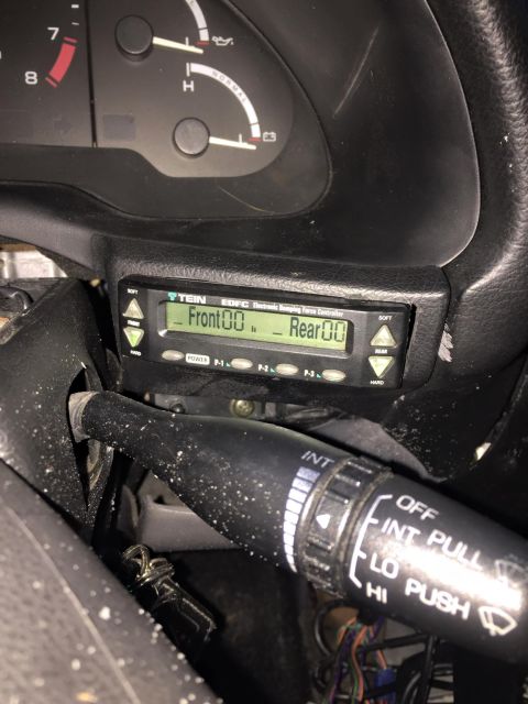 1995 Ford Probe - Close-up of a car's interior, focusing on the TEIN EDFC electronic damping force controller and the wiper control stalk.