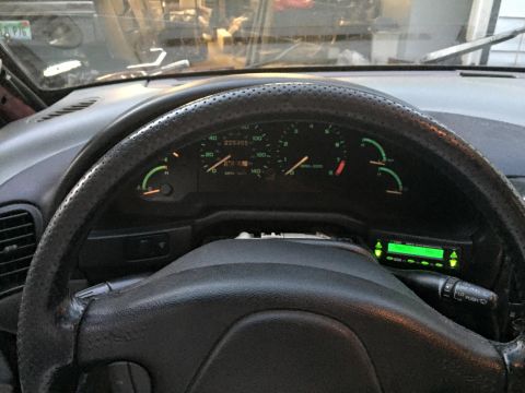 1995 Ford Probe - View of the car's interior, focusing on the dashboard and steering wheel.