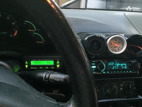 1995 Ford Probe - Interior view of a car's dashboard aftermarket gauges and a stereo system.