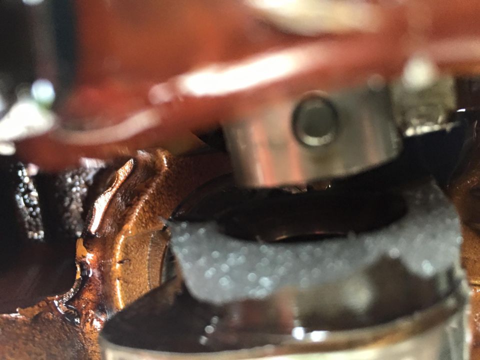 Close-up of engine internals, possibly a valve or camshaft component