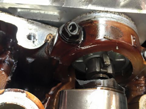 1995 Ford Probe - Close-up view of a greasy engine component, likely a valve cover or similar part.