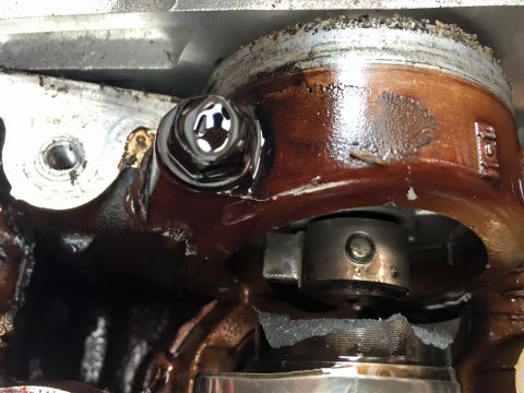 1995 Ford Probe - This image shows a close-up view of an oily engine component, possibly a valve or piston assembly.