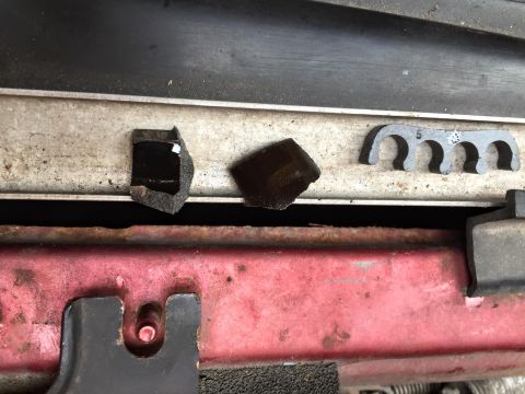 1995 Ford Probe - Broken plastic fragments and a wire loom clip are visible in this close-up view.