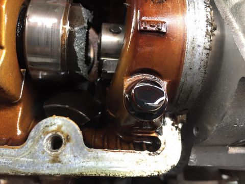 1995 Ford Probe - Internal engine damage is visible in this close-up shot of a mechanical part.
