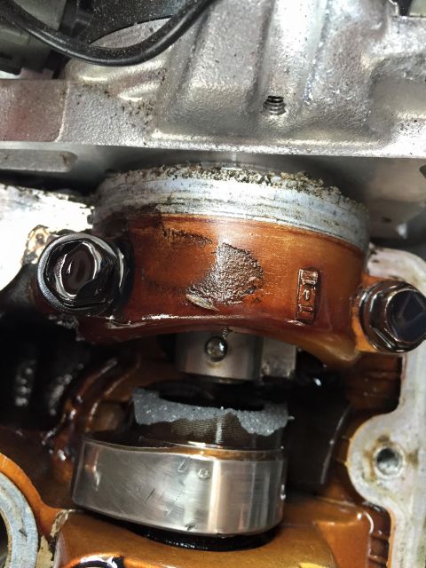 1995 Ford Probe - Close-up view of an internal engine component, showing wear and oil accumulation.