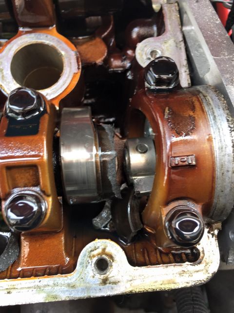 1995 Ford Probe - Damaged engine camshaft and valve train components are visible in this close-up view.