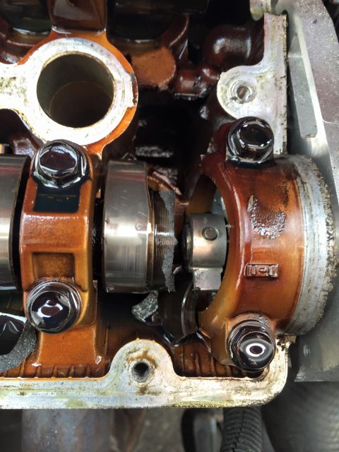 1995 Ford Probe - Internal engine damage is visible, showing broken components within the valve train assembly.