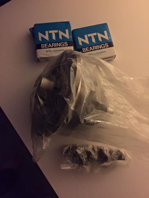 1995 Ford Probe - Two boxes of NTN bearings and engine parts are laid out on a surface.