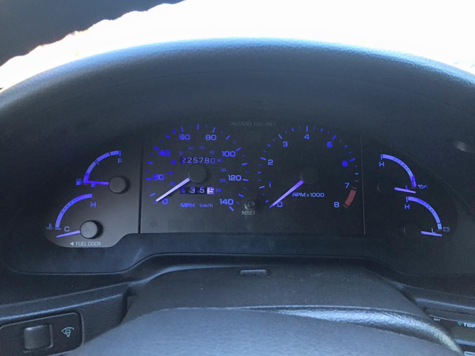 dashboard gauges with odometer showing 225780 miles and speedometer reading about 35 mph