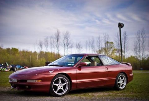 1995 Ford Probe - Red 1995 Ford Probe coupe with five-spoke wheels sits on a gravel surface.
