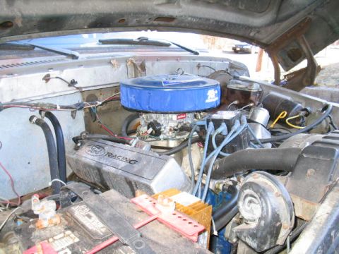 1979 Ford Bronco - Engine bay of a 1979 Ford Bronco, Ford Racing valve covers and a prominent blue air filter.