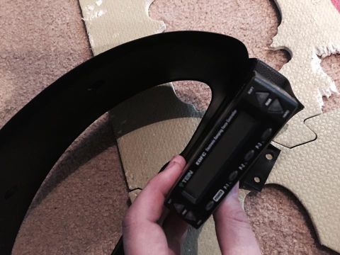 1995 Ford Probe - A hand holds a black TEIN EDFC electronic damping force controller with a digital display and buttons. The controller is positioned over a…