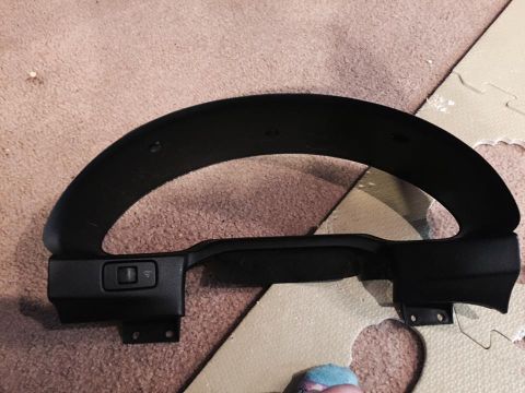 1995 Ford Probe - A black dashboard trim piece with a single switch is shown from a top-down angle. The trim piece appears to be for a car's instrument clust…