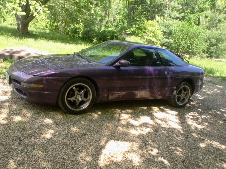 Purple 1995 Ford Probe GT parked on gravel driveway