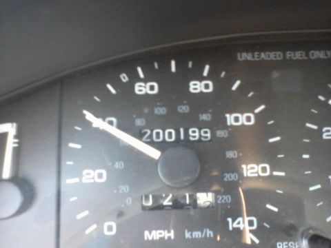 1995 Ford Probe - The image shows a close-up of a car's speedometer and odometer. The needle is pointing just below 60 mph, and the odometer reads 200199.