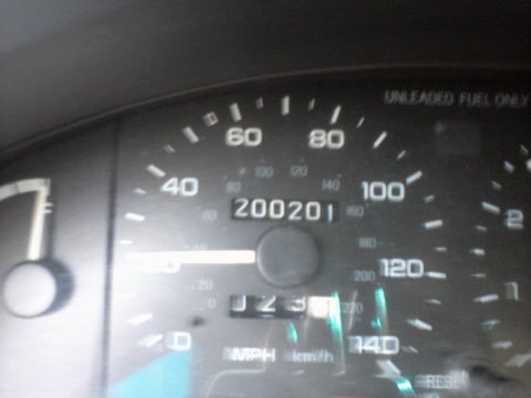 1995 Ford Probe - The image shows a close-up of a car's odometer and speedometer. The odometer reads 200201, and the speedometer is at 0 MPH.