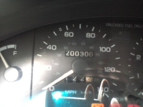1995 Ford Probe - The image shows a close-up of a car's dashboard, focusing on the speedometer and fuel gauge. The speedometer reads approximately 200,300 mi…