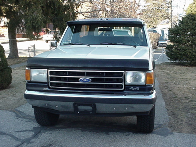 1993 Ford Bronco front view with black bug deflector and sun visor