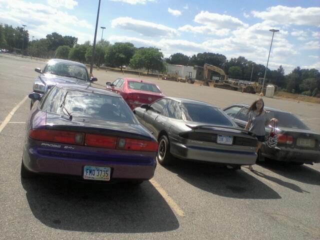 Purple car with spoiler and license plate FMO 3735, rear view