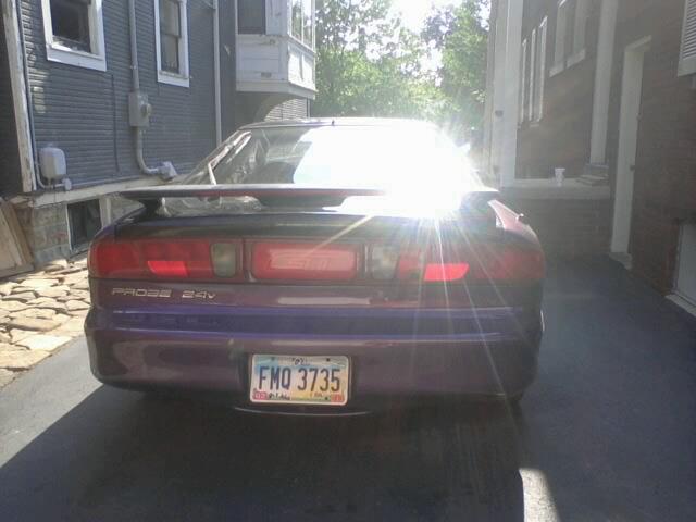 Purple 1995 Ford Probe rear with spoiler and license plate FMO 3735
