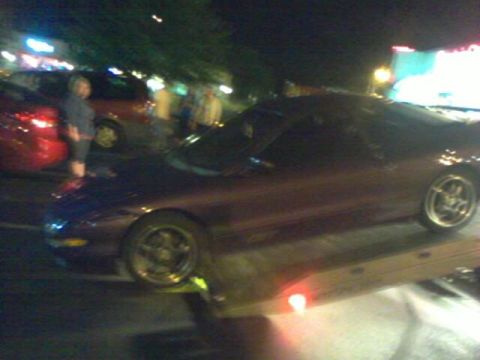 1995 Ford Probe - This 1995 Ford Probe is being loaded onto a tow truck.