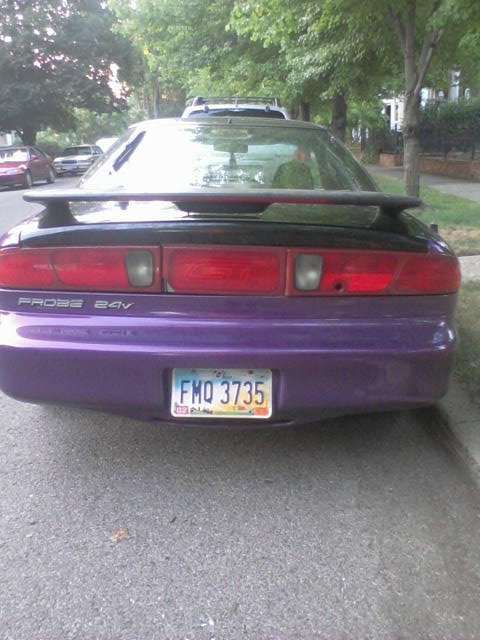 1995 Ford Probe - The rear of a 1995 Ford Probe, a distinctive purple lower body panel and 'PROBE 24V' badging.