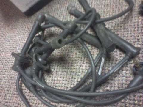 1995 Ford Probe - A close-up view of a set of spark plug wires, likely for a vehicle's engine.