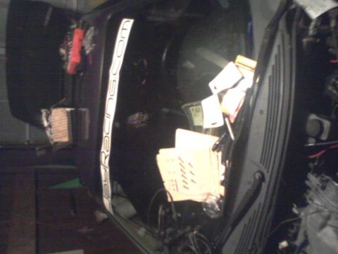 1995 Ford Probe - A close-up view of the interior of a car, showing a white sticker with black text that reads "BYRACING.COM" on the driver's side door panel…