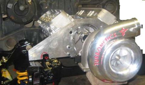 1973 Ford Ranchero - Close-up view of a custom turbocharger system installed on an engine.