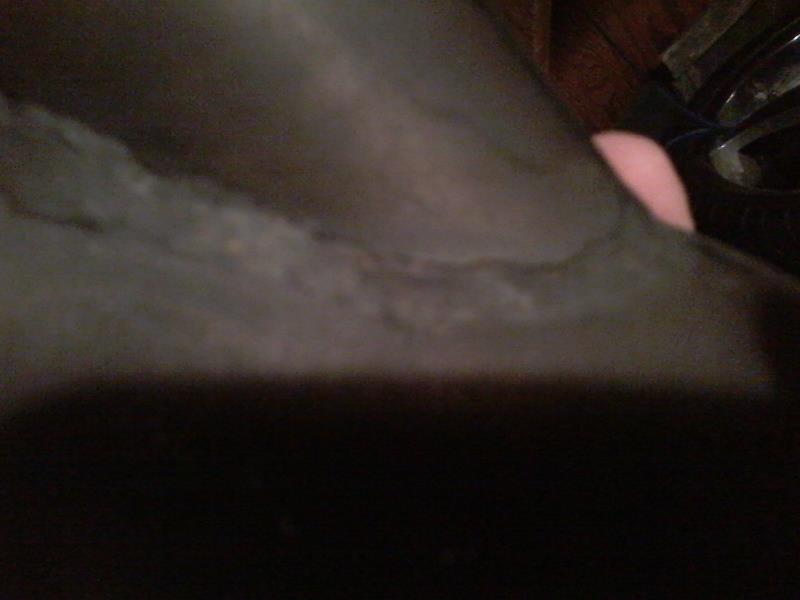 Blurry close-up of a car interior with a pink object.